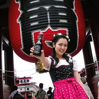 Woman holds FLENS bottle